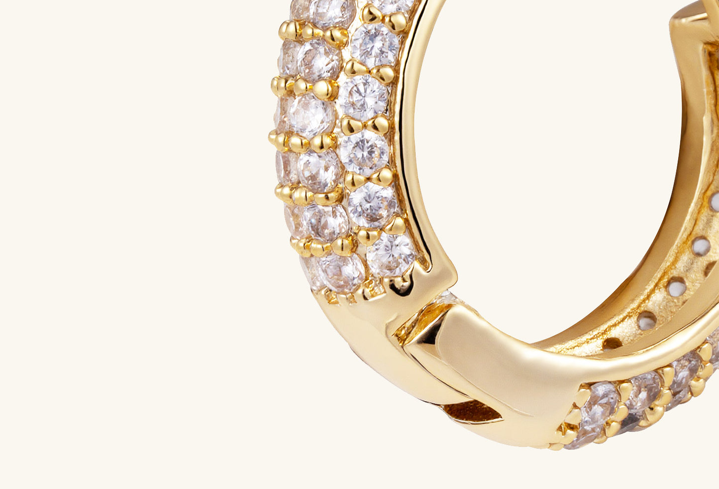 Side view of BuzzBloom 14K gold diamond hoop earrings showing slim huggie design and elegant sparkle