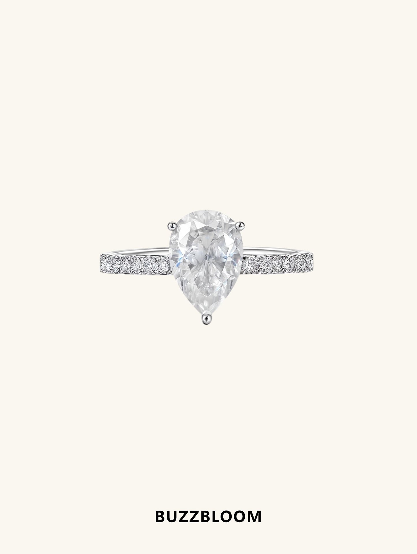 Front view of BUZZBLOOM 14K large teardrop-shaped diamond ring with pavé band