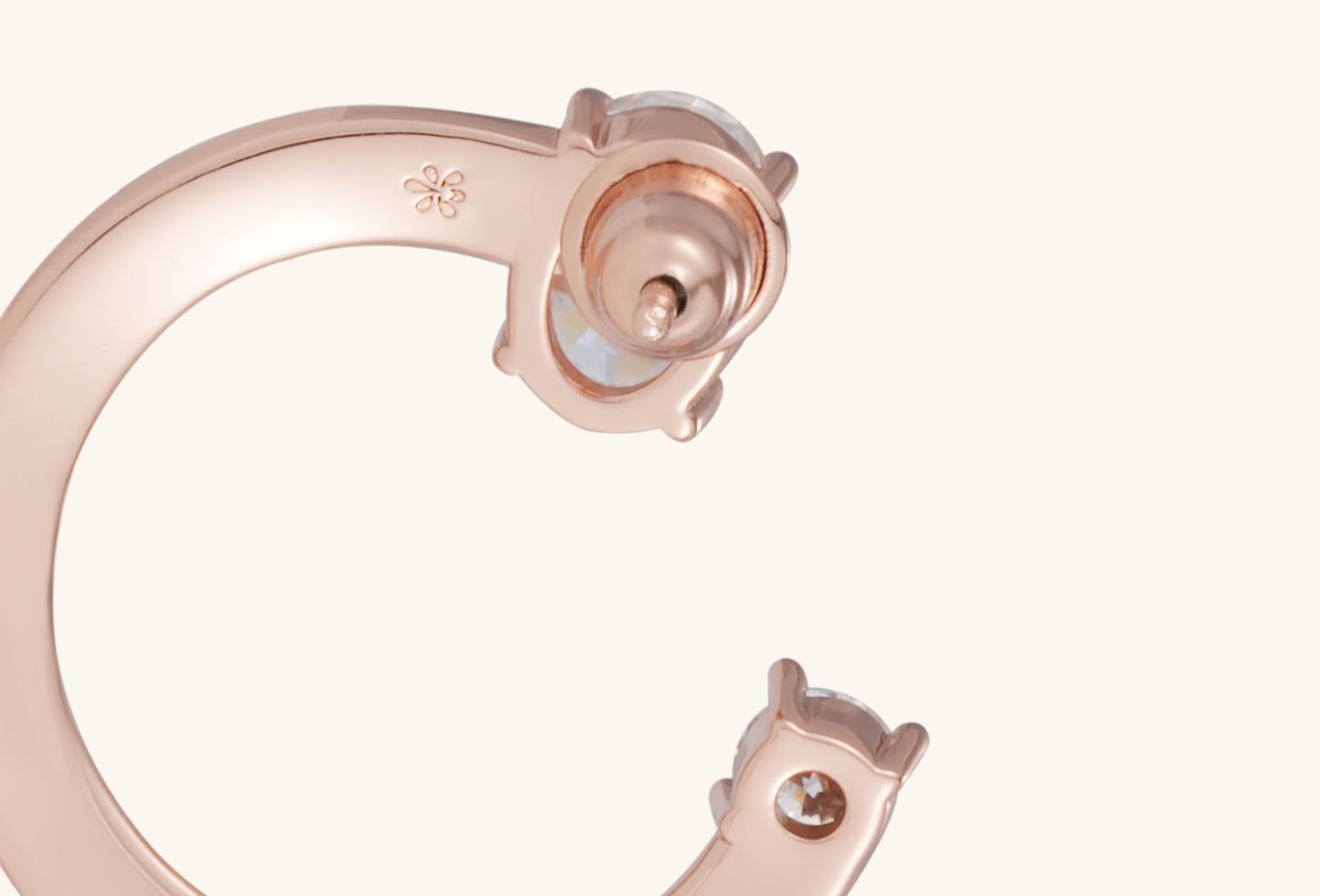 Close-up of diamond setting on BuzzBloom 14K rose gold fashion earrings