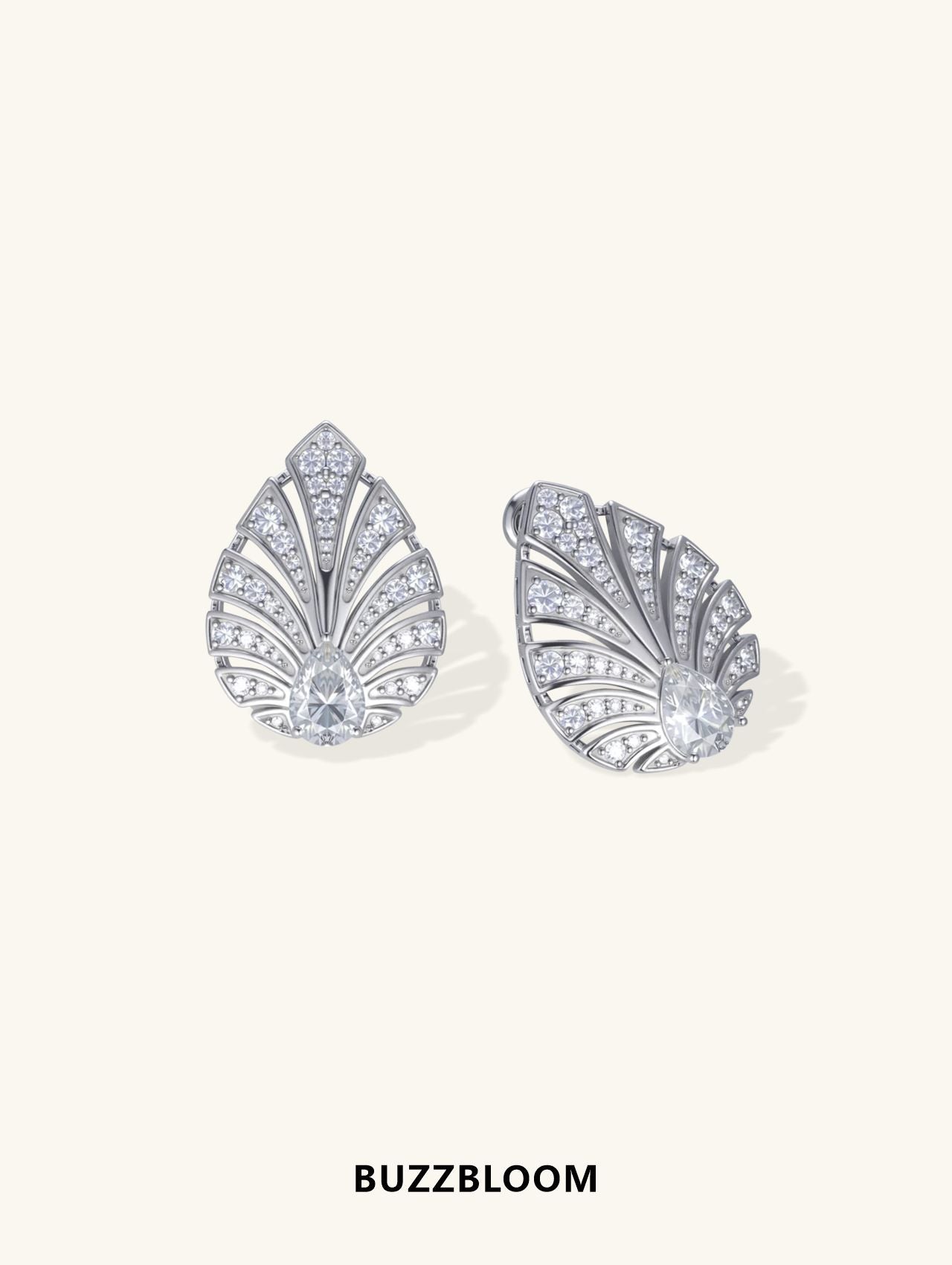 BuzzBloom 14K white gold earrings featuring pave-set diamonds and pear-shaped center stone, angled view.