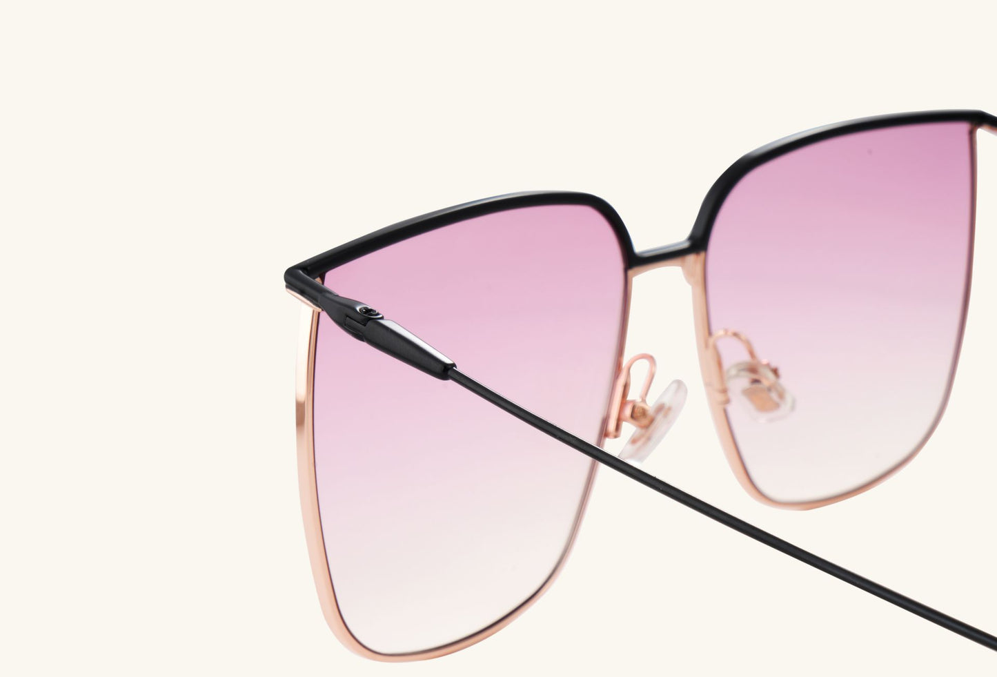 Detailed view of BUZZBLOOM Color-Blocked Large Frame Sunglasses adjustable nose pads and temple