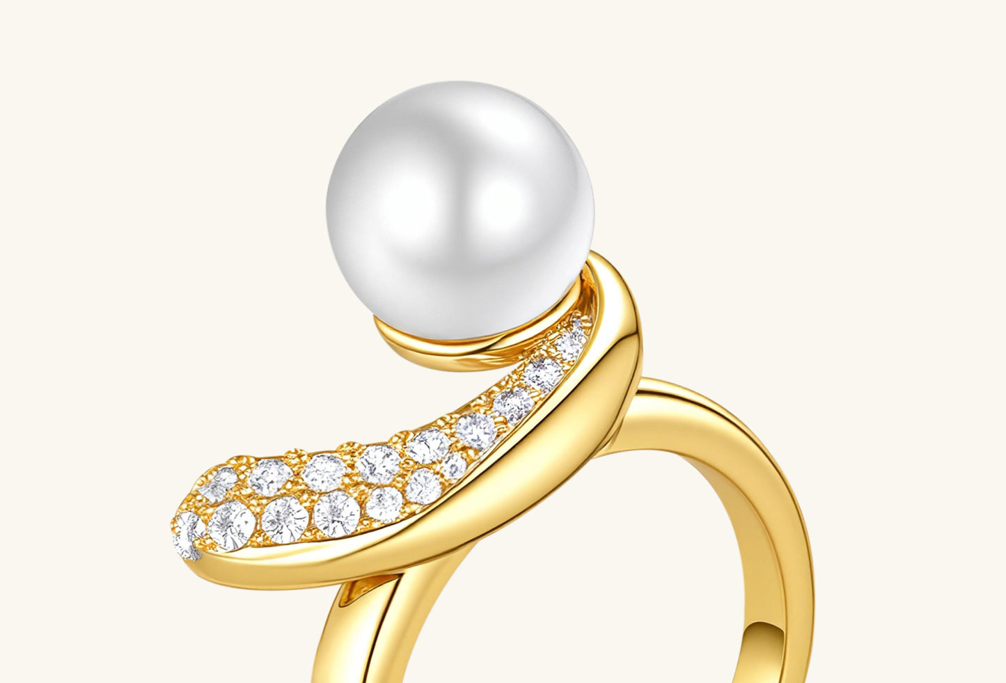 Close-up of BuzzBloom 14K gold ring showing Australian white shell pearl and pavé diamonds.