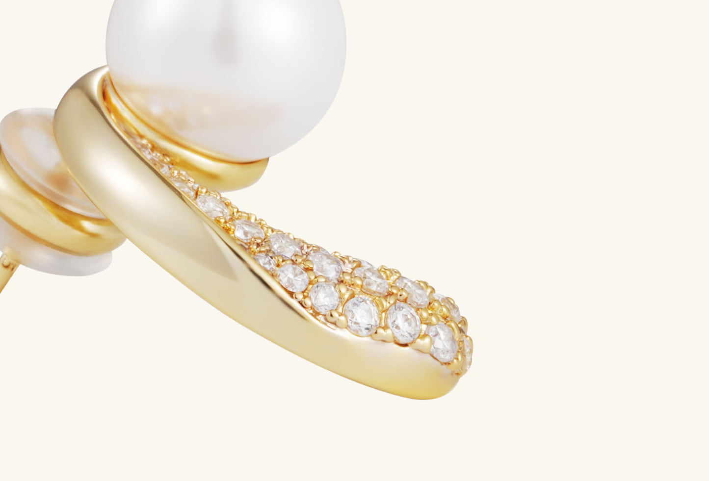 Close-up of Buzzbloom Australian White Shell Pearl 14K Diamond Stud Earring, showing intricate diamond pavé setting.
