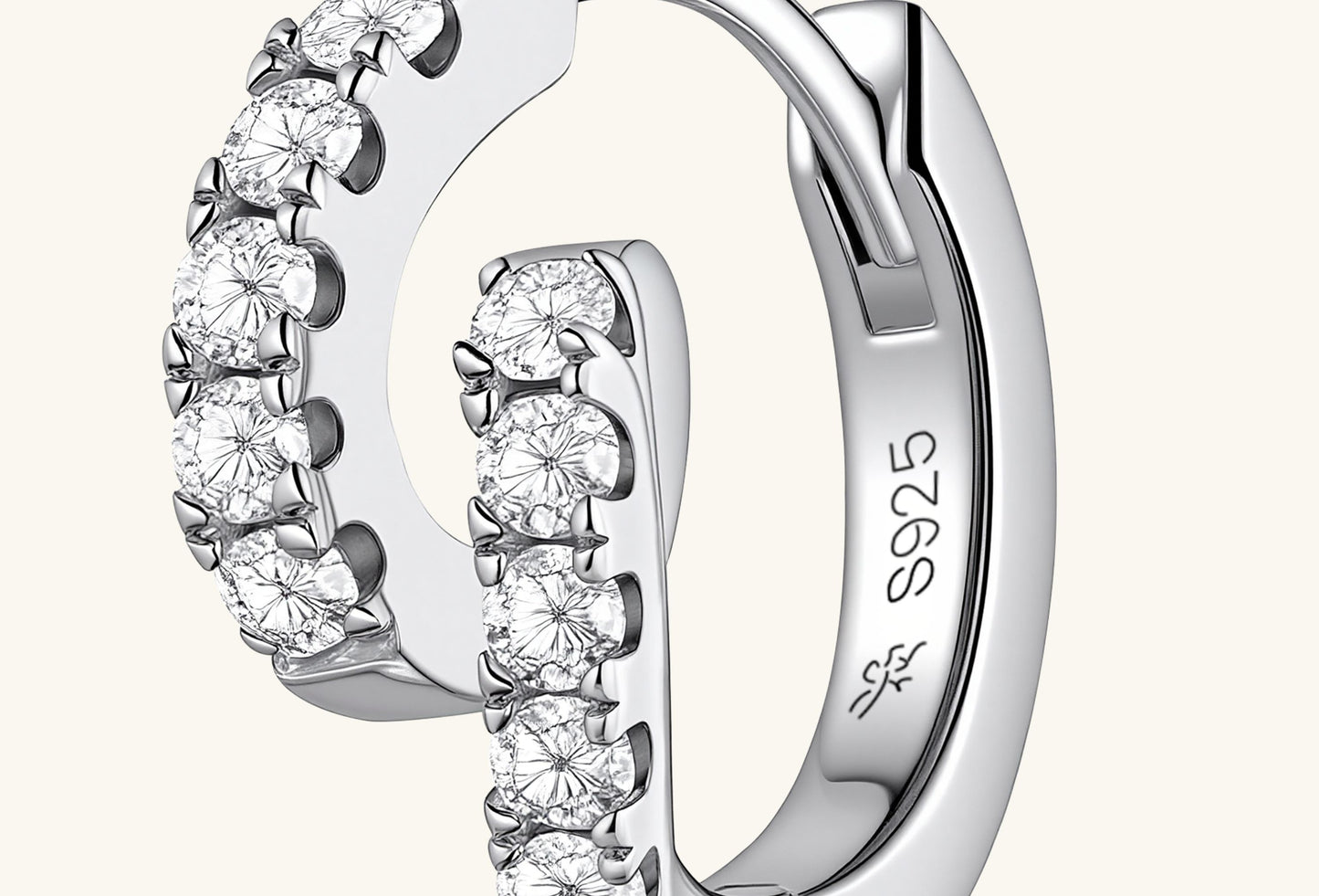 Close-up of BUZZBLOOM Classic 14K Round Treasure Earrings highlighting round-cut center diamond and halo design.