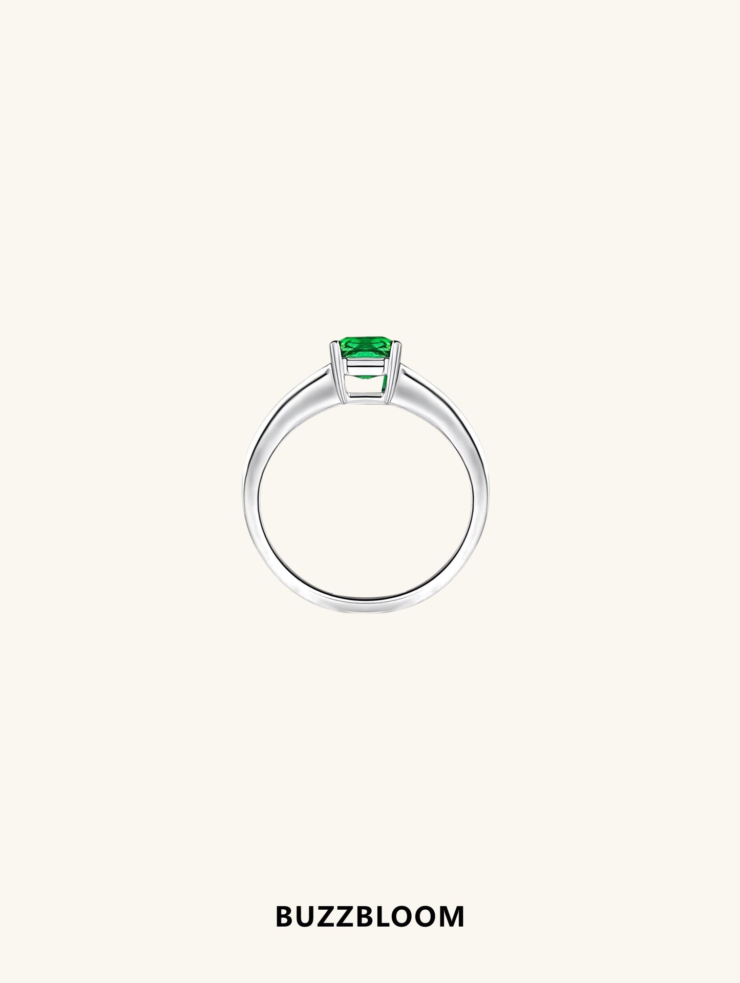 Side profile of BuzzBloom emerald-cut ring showcasing baguette detailing