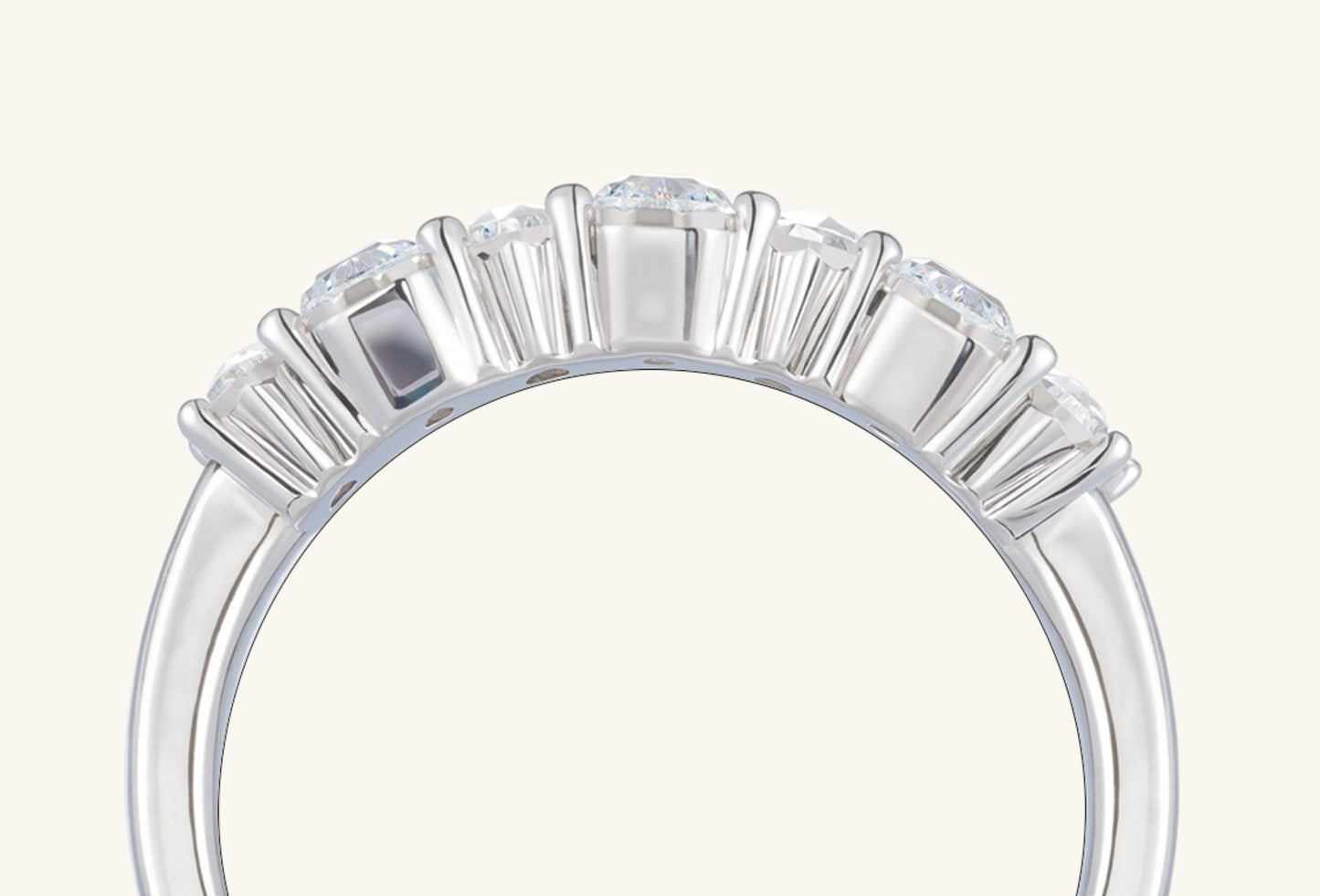 Detailed view of polished 14K white gold band on BuzzBloom emerald cut diamond multi-stone ring