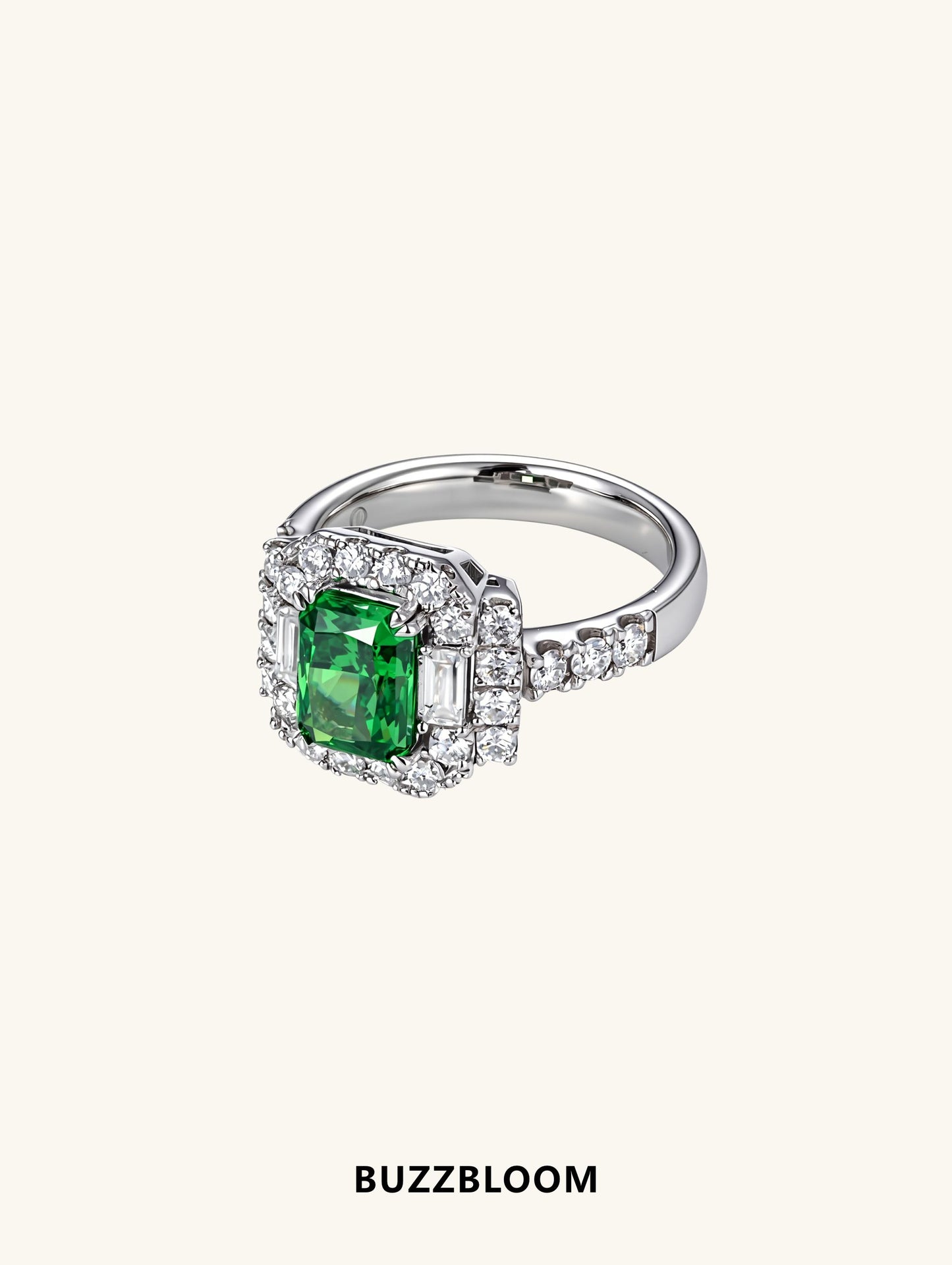 Angled shot of vintage emerald halo ring showcasing side baguettes