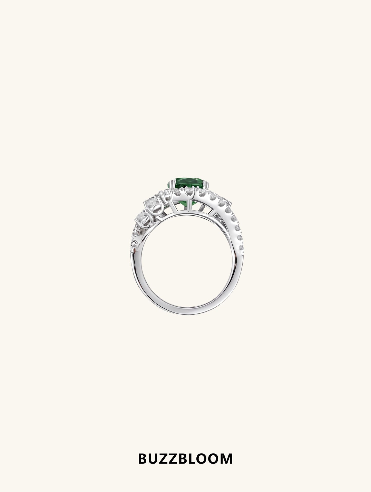 Side profile of BuzzBloom emerald oval halo diamond ring