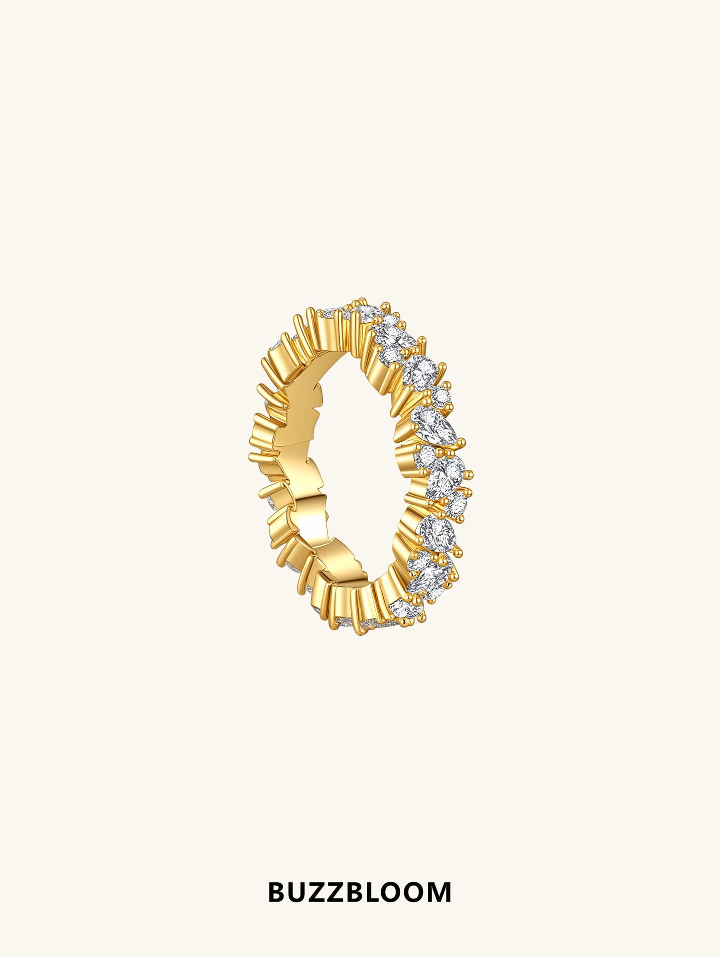 Side profile of BuzzBloom marquise and round moissanite ring in gold