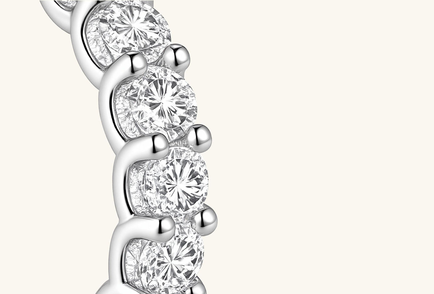 Close-up of BuzzBloom full eternity diamond band showing round diamond facets and prong craftsmanship