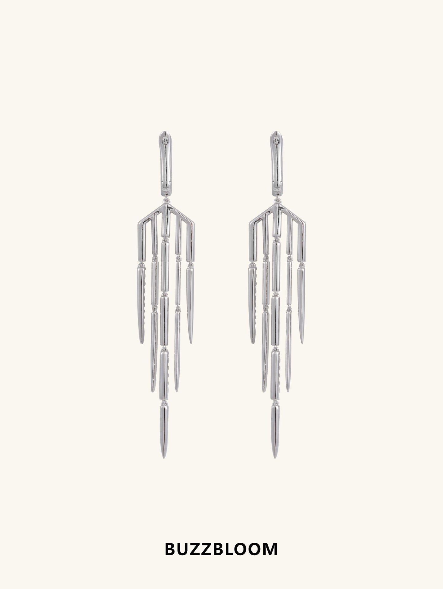 Back view of BuzzBloom geometric silver tassel fringe earrings