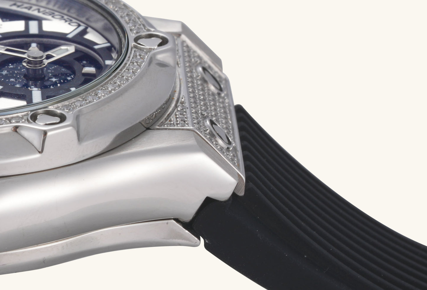 BuzzBloom close-up on the diamond-set mechanical movement and gears in stainless steel.