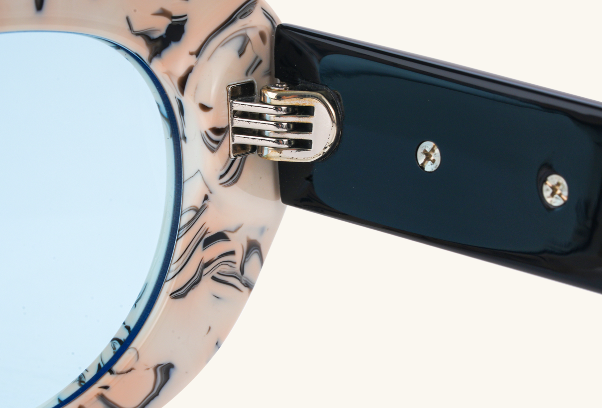 Close-up detail of BuzzBloom rectangular sunglasses hinge and arm design.