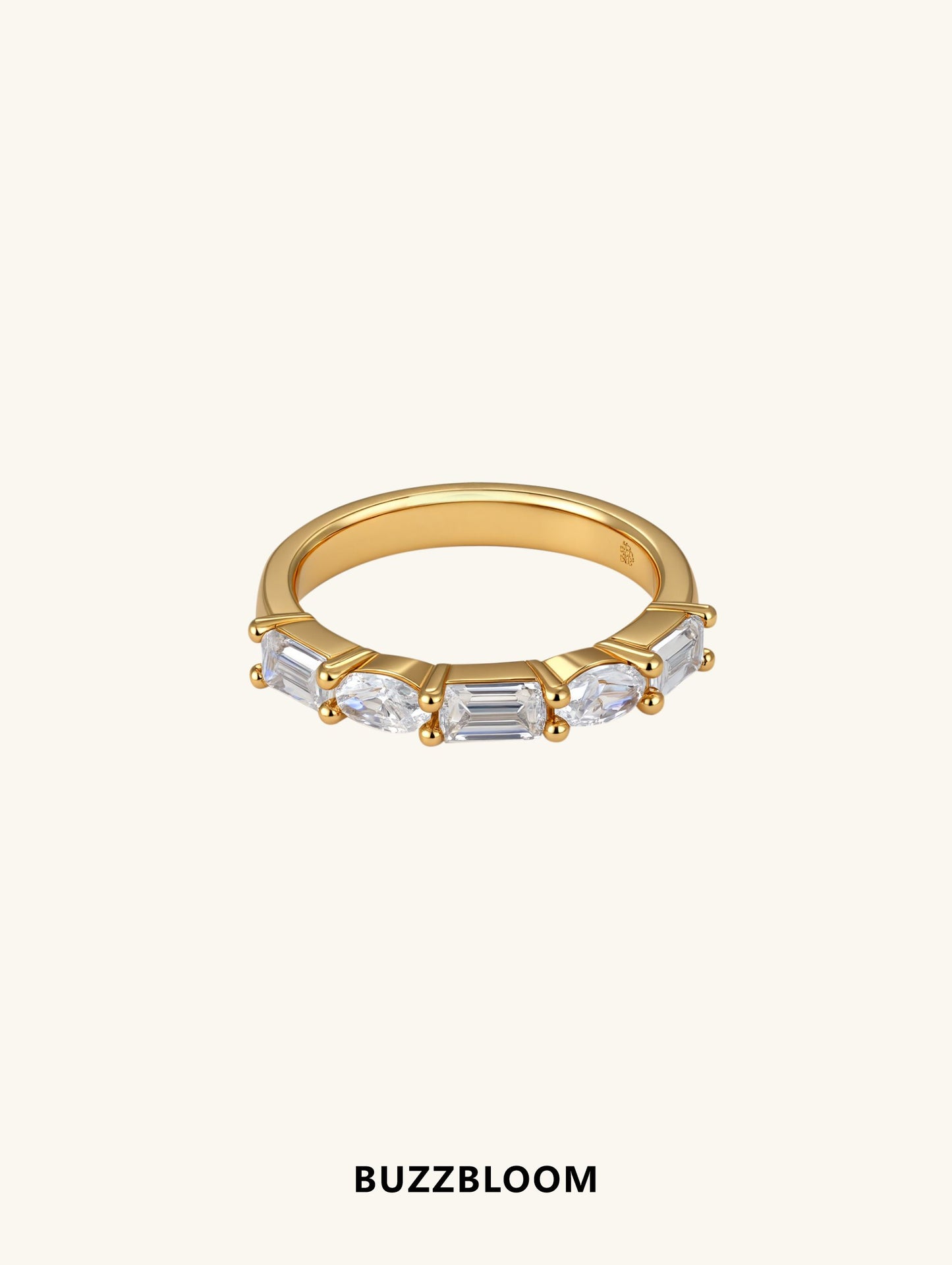 Front view of BuzzBloom oval moissanite ring with baguette side stones, gold