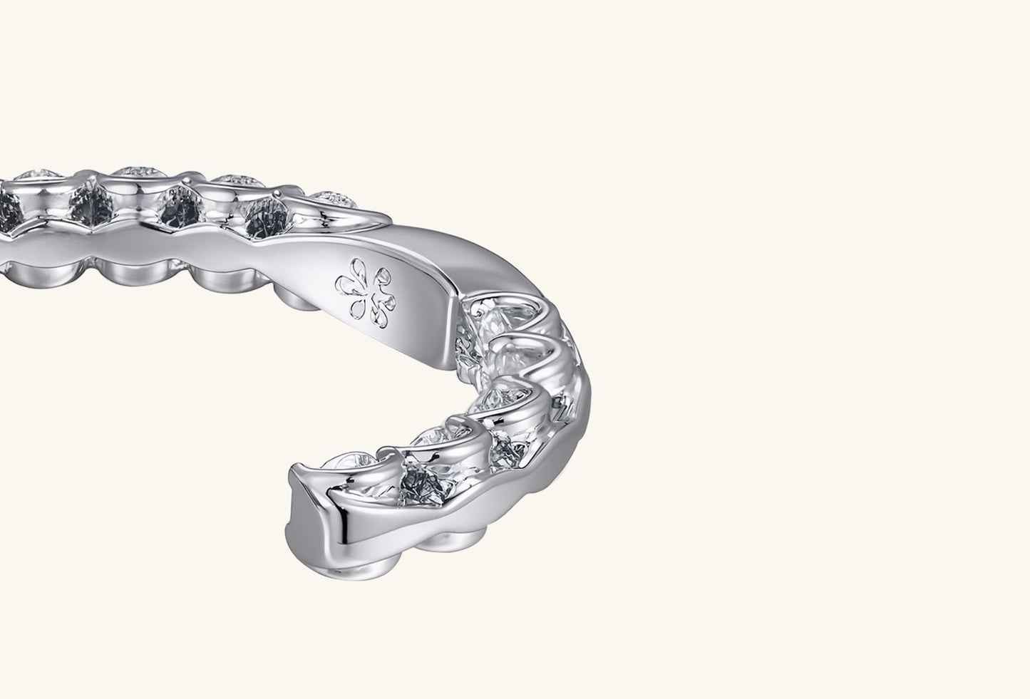 Close-up of moissanite detailing on half-hoop earrings.