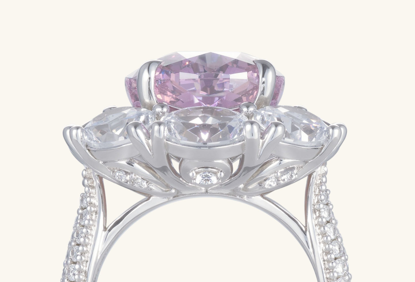 Detail view of brilliant diamond halo surrounding the oval pink center stone on BuzzBloom 14K white gold ring