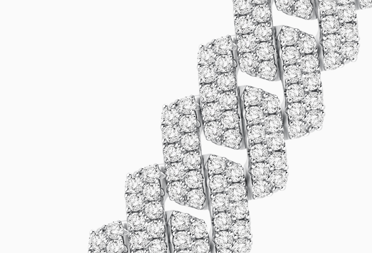 Macro shot of pavé-set diamonds on a Cuban link for BuzzBloom bracelet.