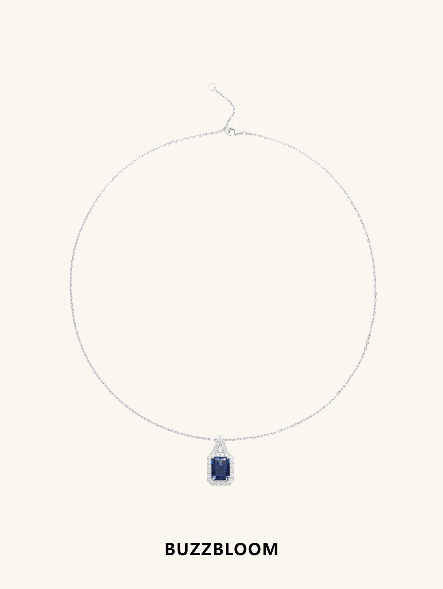 BuzzBloom sapphire halo pendant suspended on delicate chain, flat view