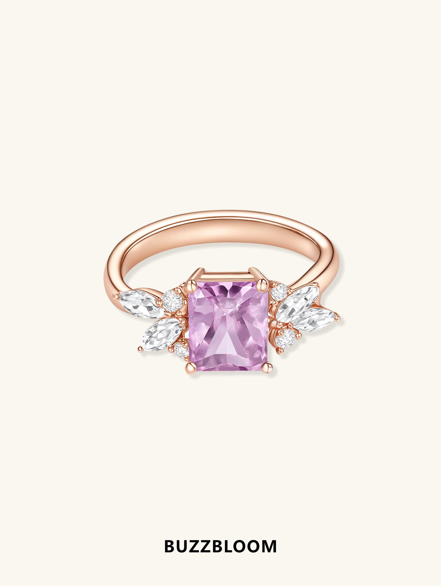 Side profile of BuzzBloom rose gold ring with pink sapphire and diamond marquise cluster.