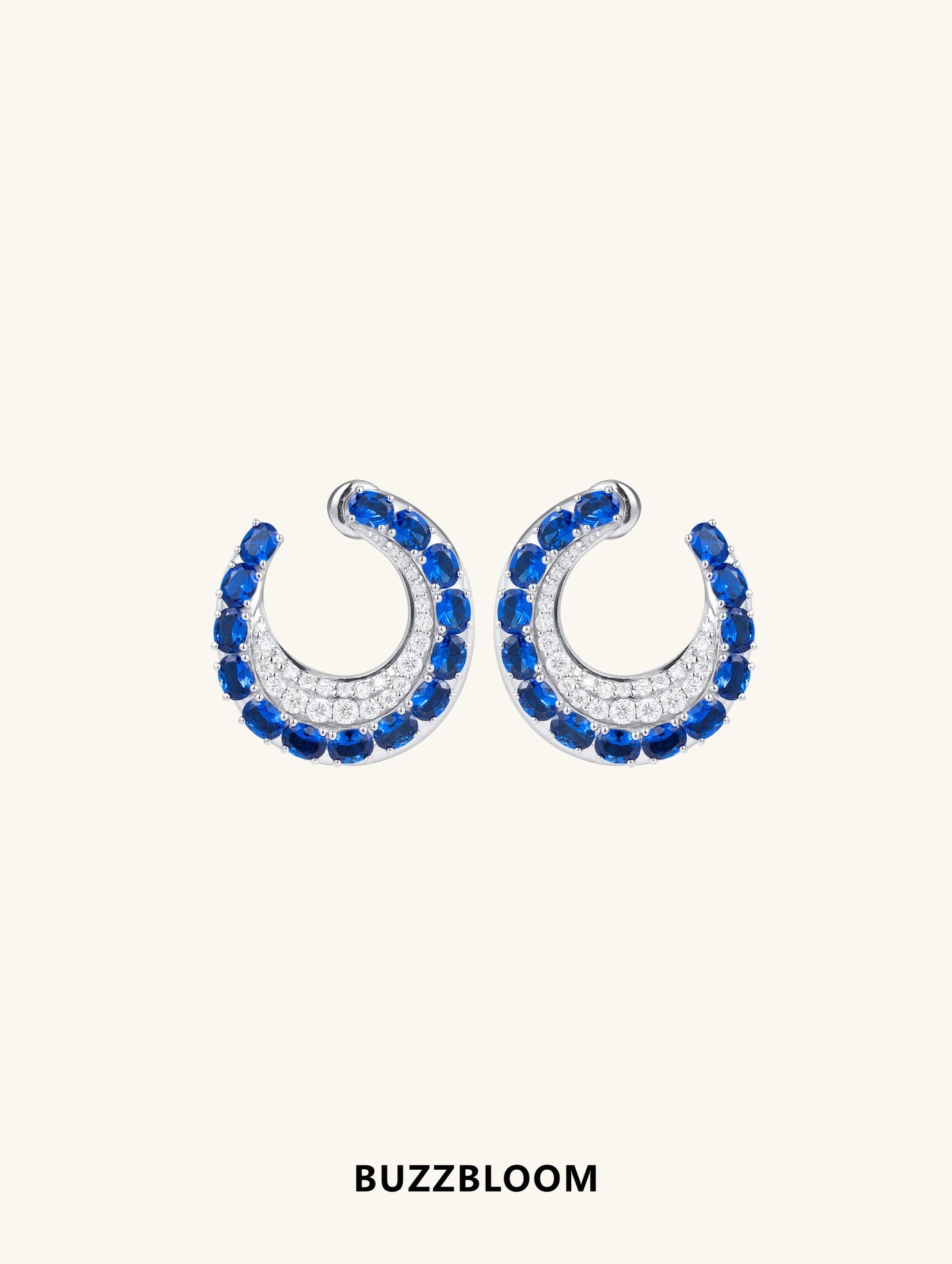 BuzzBloom sapphire hoop earrings front view with blue stones and white accents