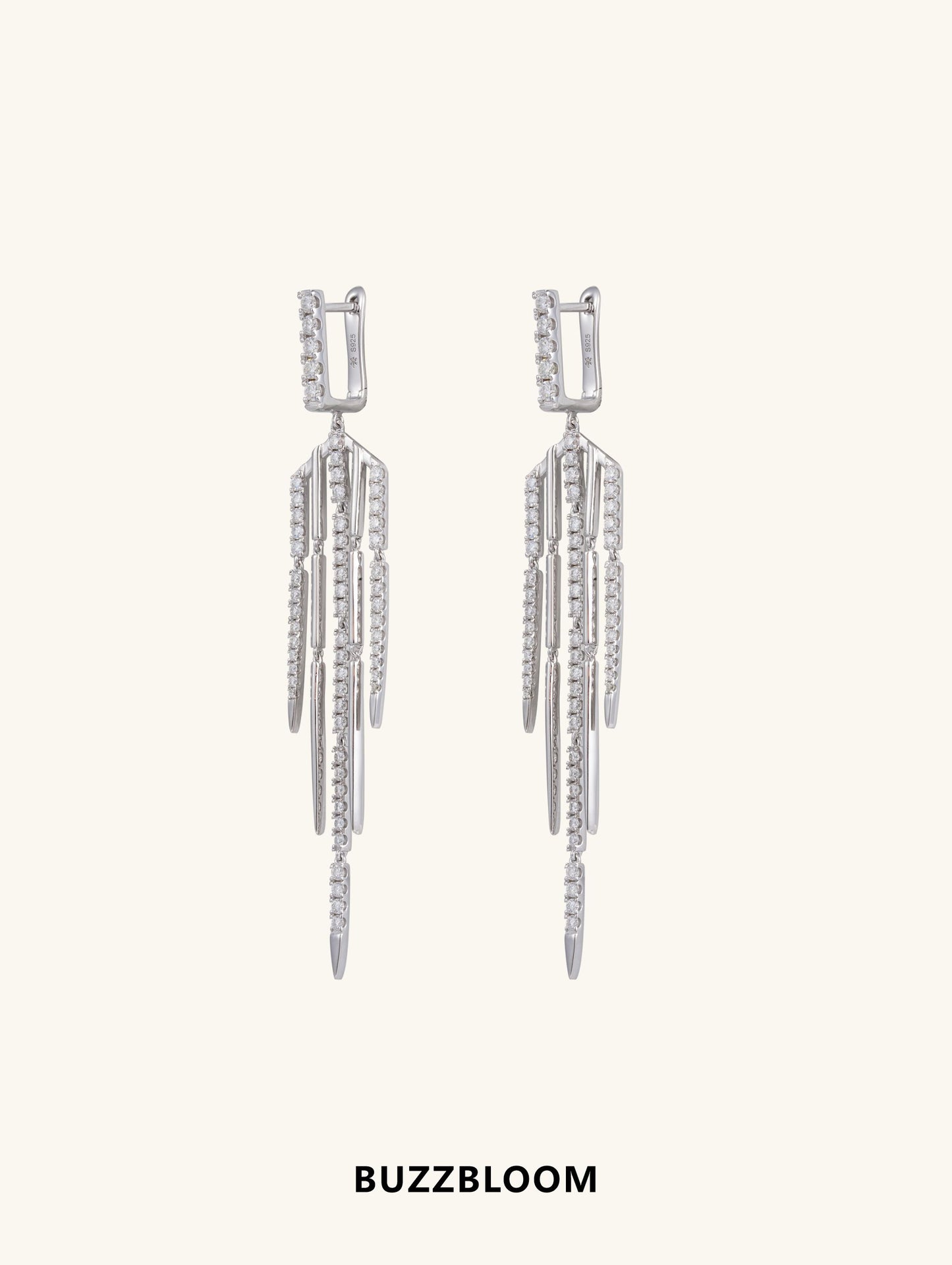 Front view of BuzzBloom geometric silver tassel fringe earrings
