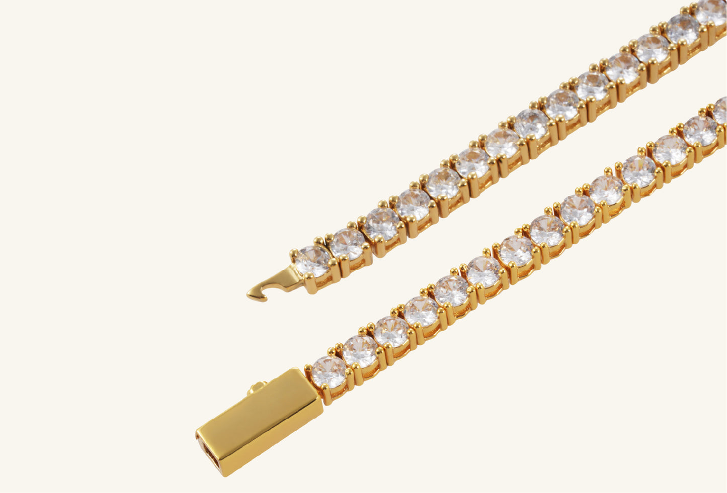 Detailed view of BuzzBloom gold tennis necklace diamond settings