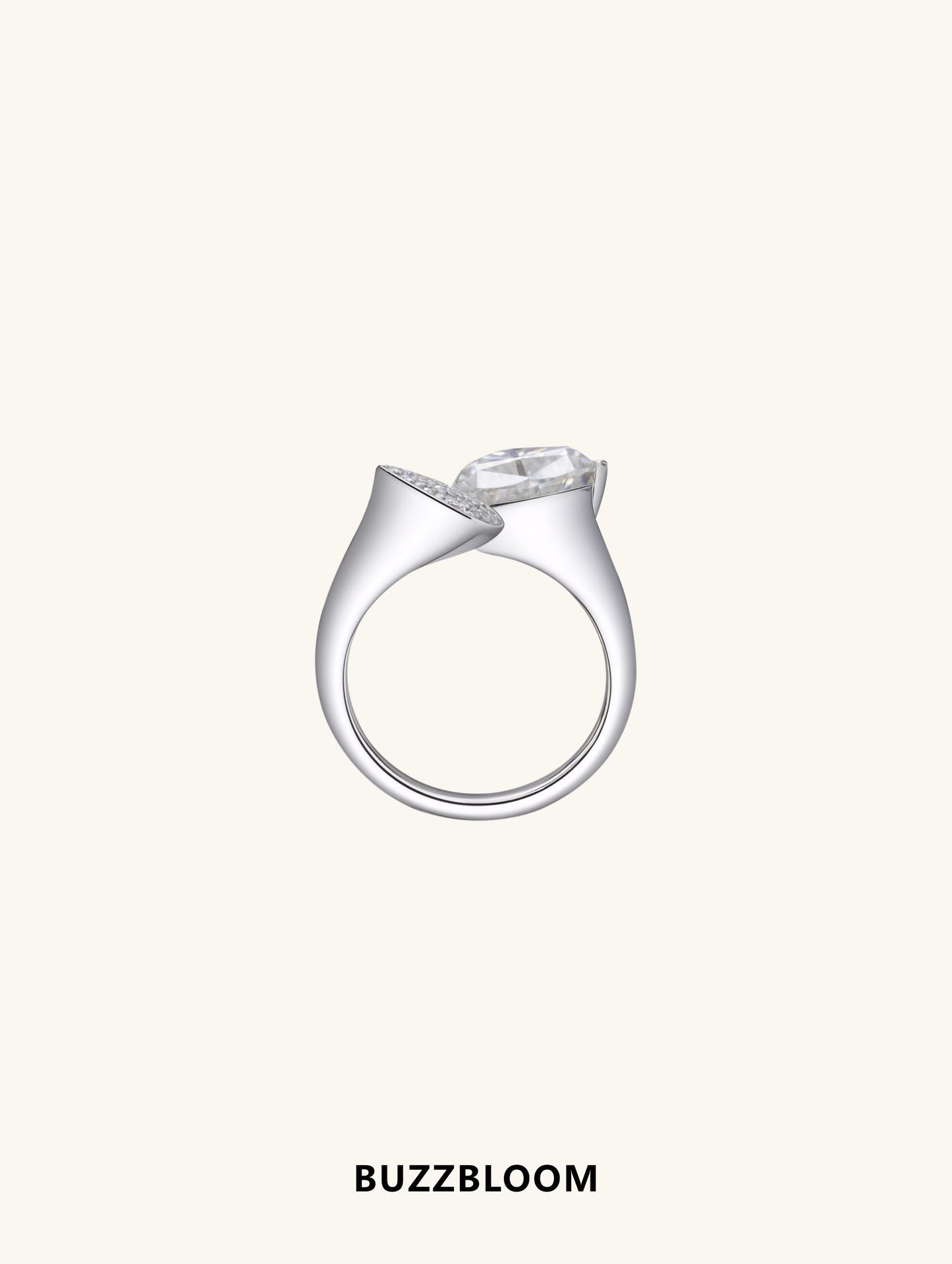 Side profile of BuzzBloom ring showing open bypass band and trillion stone