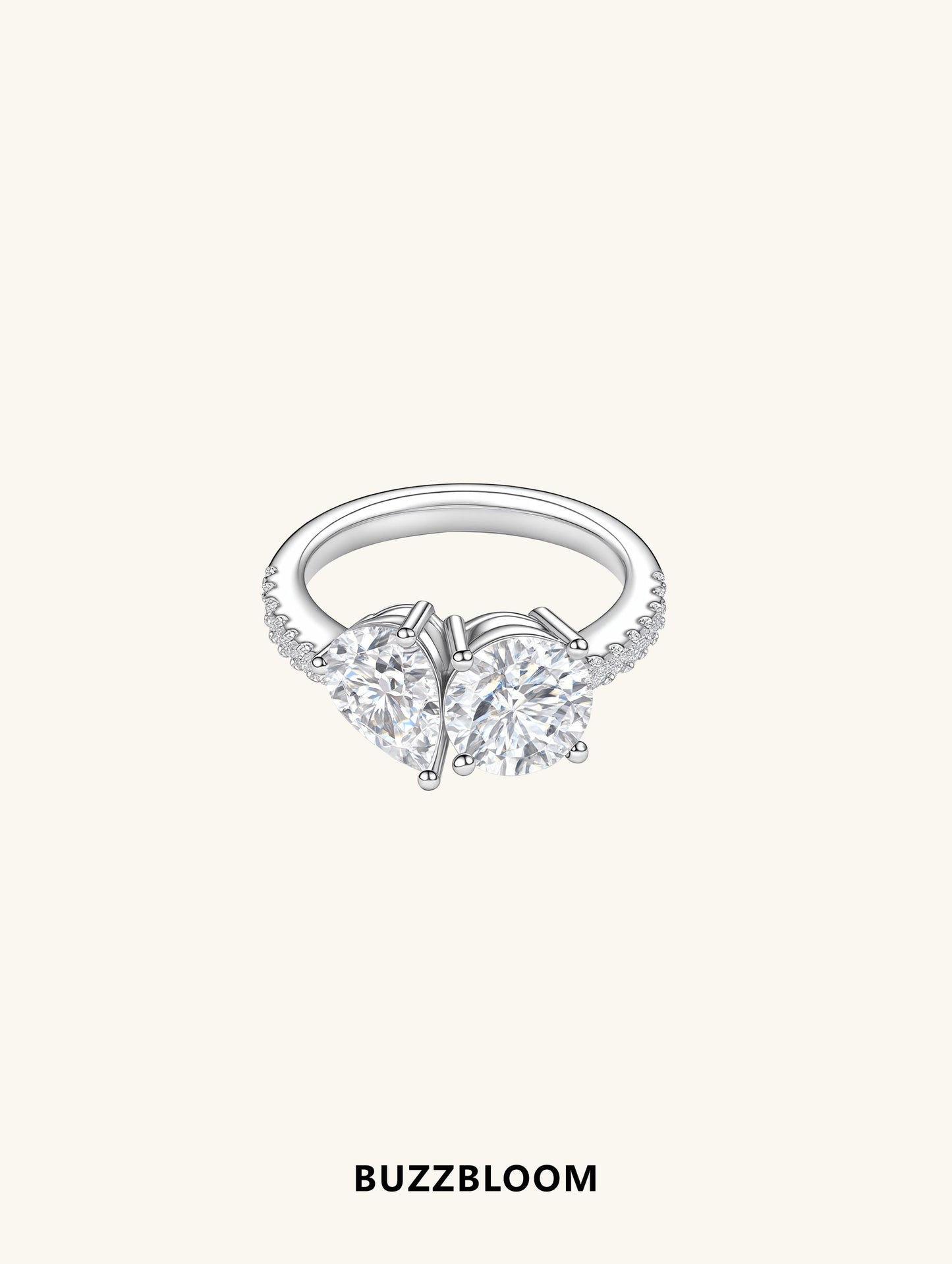 Front view of BuzzBloom two-stone Toi et Moi ring with pear and round stones