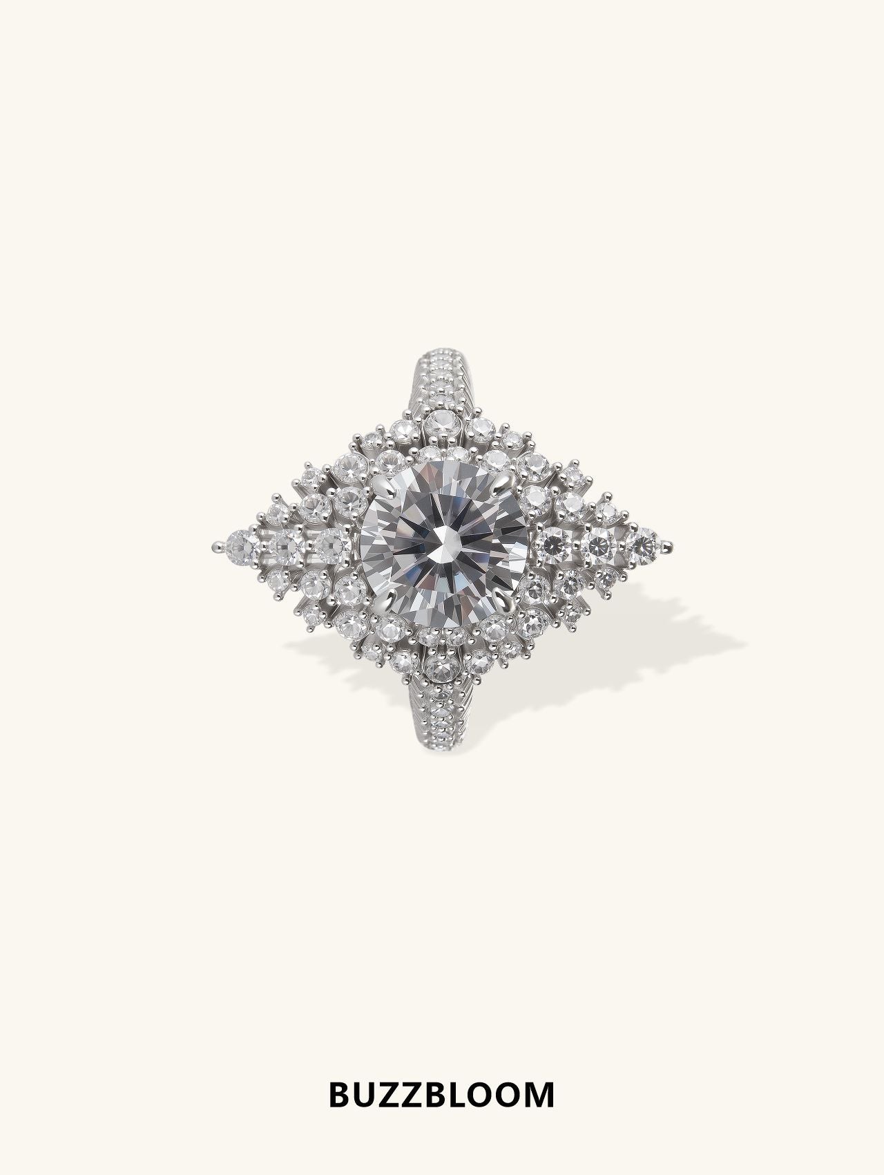 Exquisite 14K white gold Snow Queen diamond ring by BuzzBloom, front view, featuring a brilliant round center stone with intricate snowflake design for winter weddings and statement style.